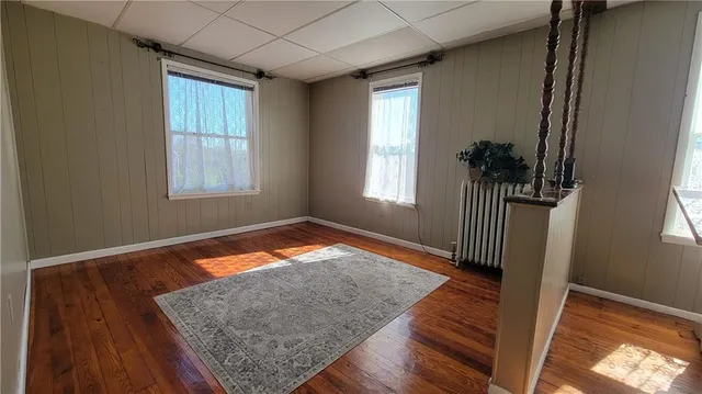 a kitchen with a sink a stove a microwave a counter top space and cabinets