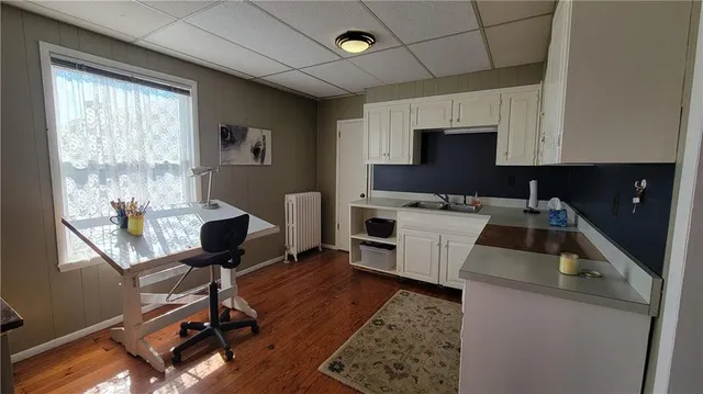 a utility room with sink dryer and washer