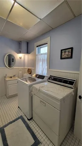 a bathroom with a sink a mirror and a shower