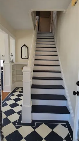 a view of living room with furniture and lamp