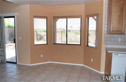 1118 South Riparian Avenue Tucson, AZ 85748 - Photo 5 of 13 an empty room with windows and closet