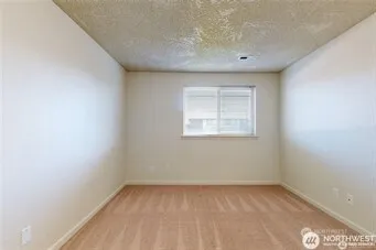 an empty room with a empty space and window