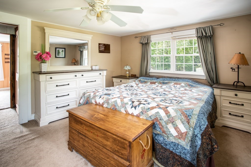 15 County Road East Freetown, MA 02717 - Photo 19 of 36 a bedroom with a bed and a mirror on dresser