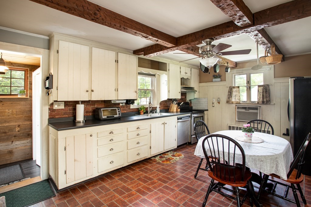15 County Road East Freetown, MA 02717 - Photo 5 of 36 a kitchen with granite countertop a sink and white appliances