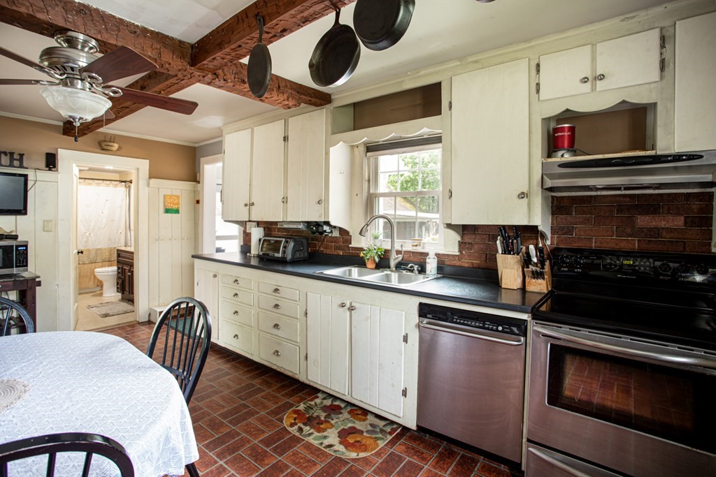 15 County Road East Freetown, MA 02717 - Photo 6 of 36 a kitchen with stainless steel appliances granite countertop a stove a sink and a refrigerator