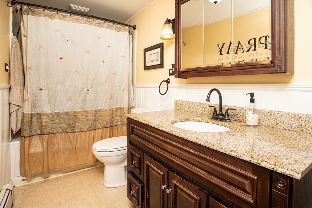 15 County Road East Freetown, MA 02717 - Photo 8 of 36 a bathroom with a granite countertop sink a toilet and shower