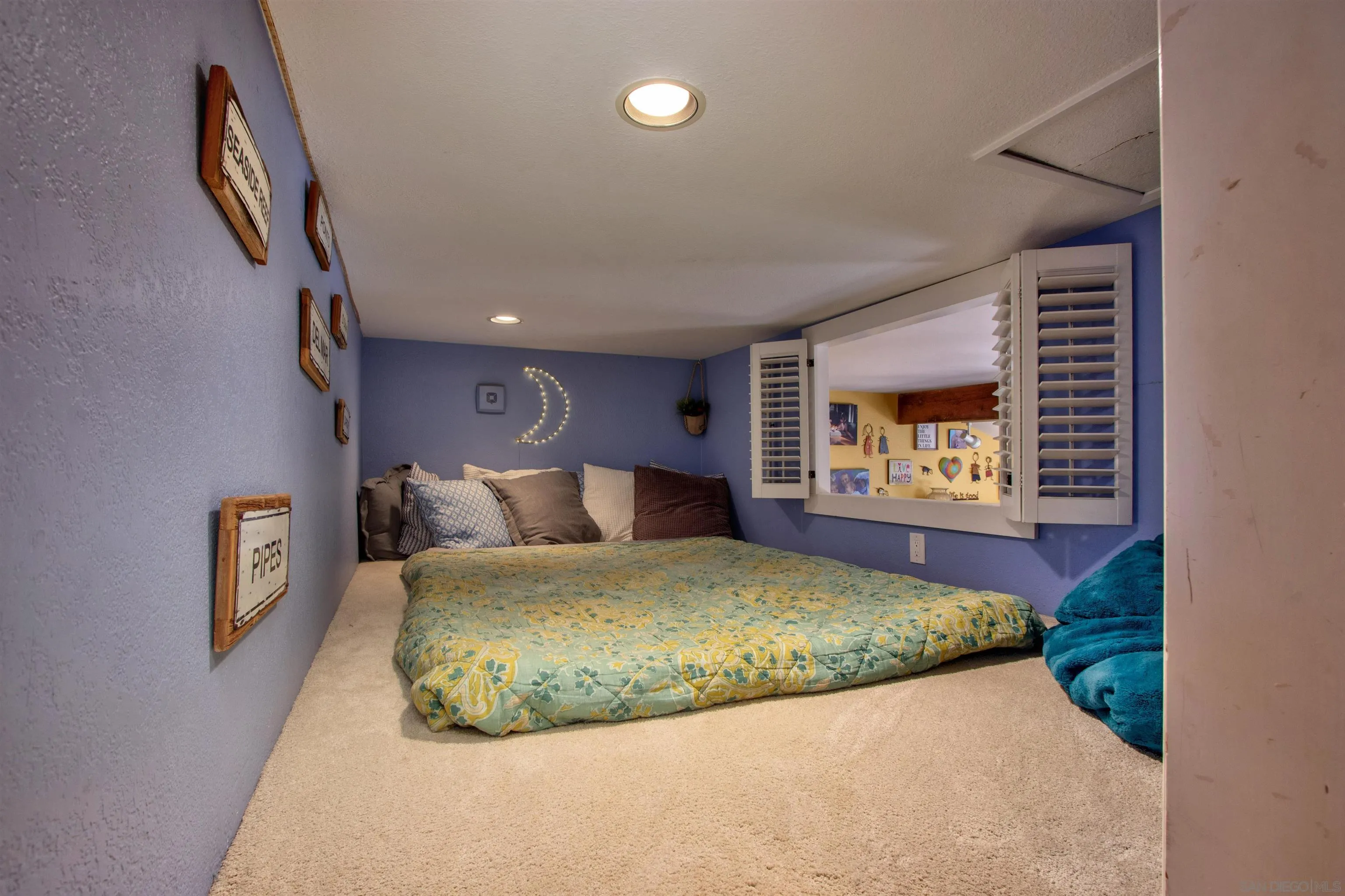1041 Solana Drive Del Mar, CA 92014 - Photo 11 of 44 a bedroom with a bed and a painting on the wall