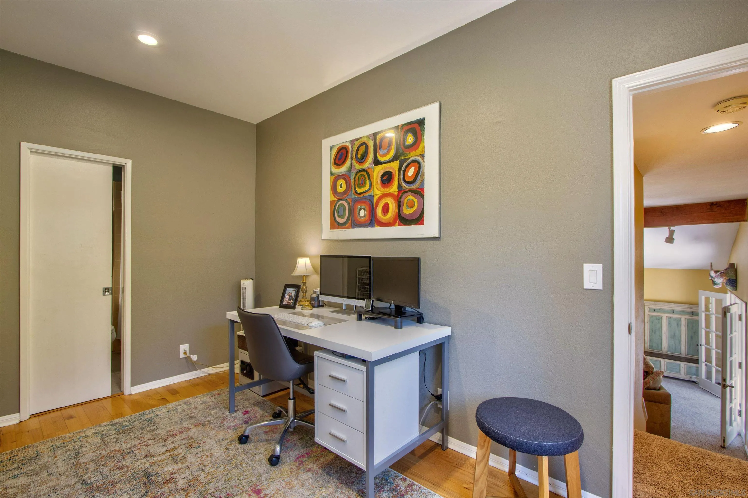 1041 Solana Drive Del Mar, CA 92014 - Photo 12 of 44 a workspace with furniture and lamp