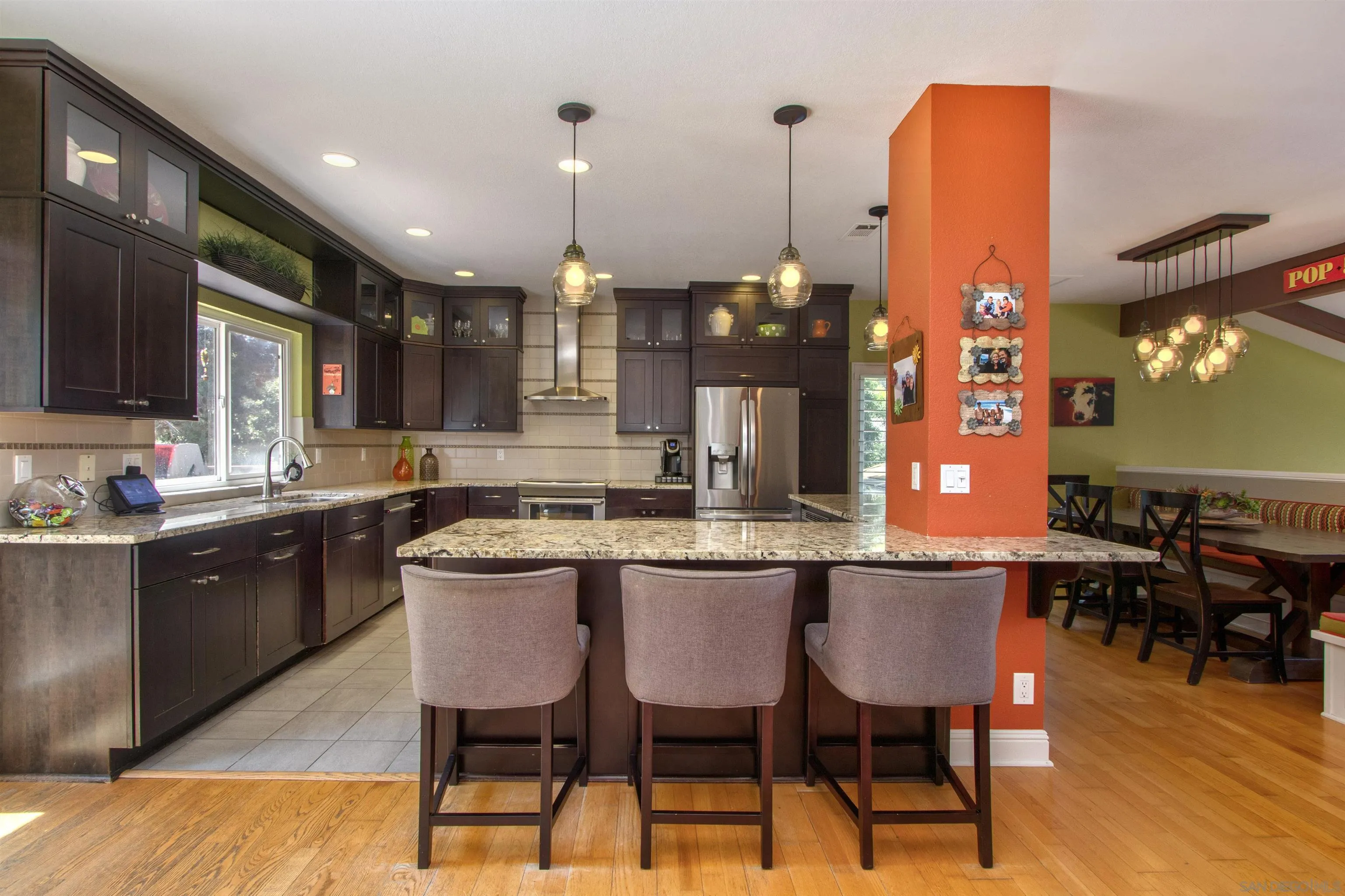 1041 Solana Drive Del Mar, CA 92014 - Photo 17 of 44 a kitchen with a table and chairs in it