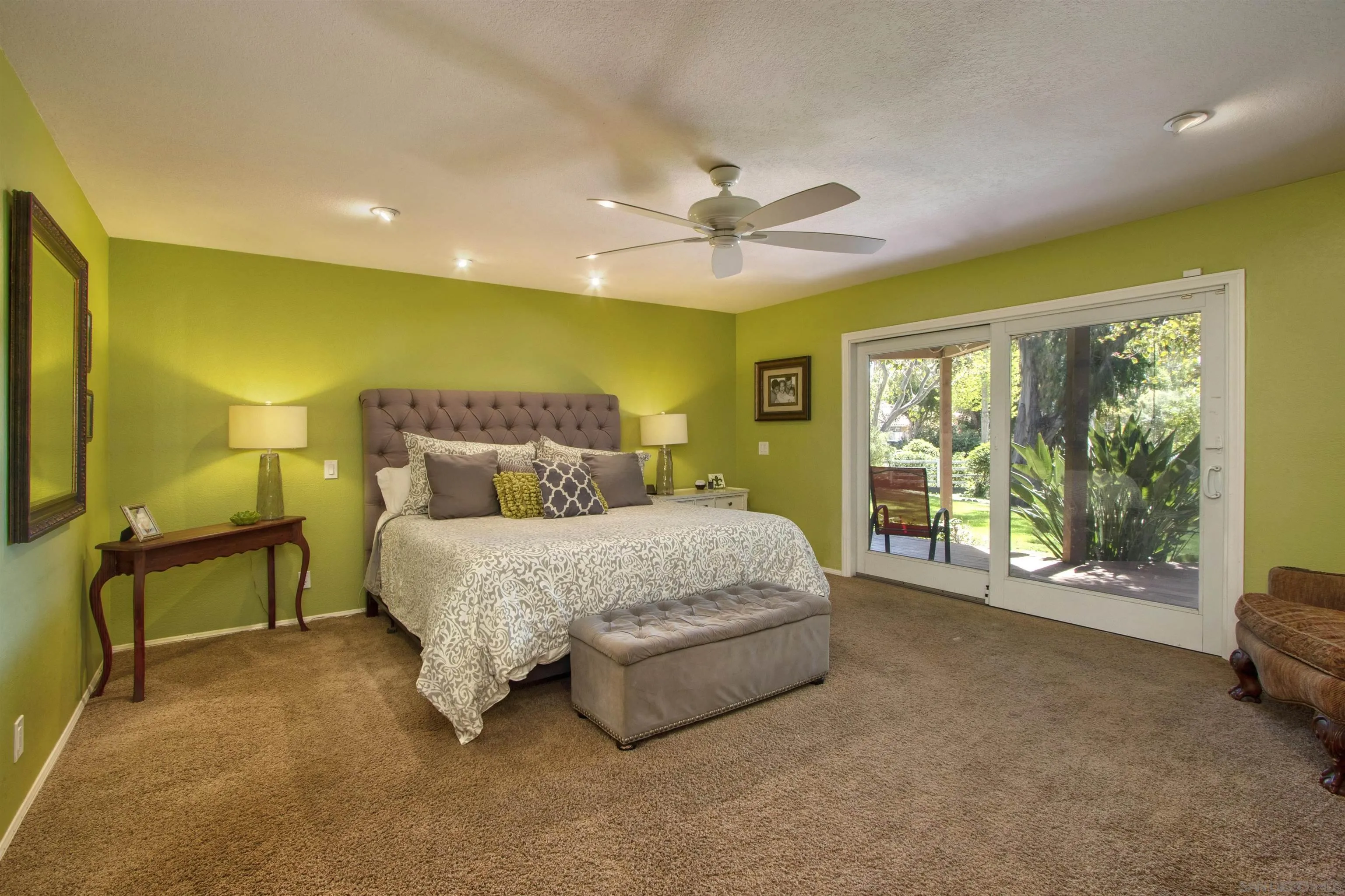 1041 Solana Drive Del Mar, CA 92014 - Photo 21 of 44 a bed sitting in a room next to a window