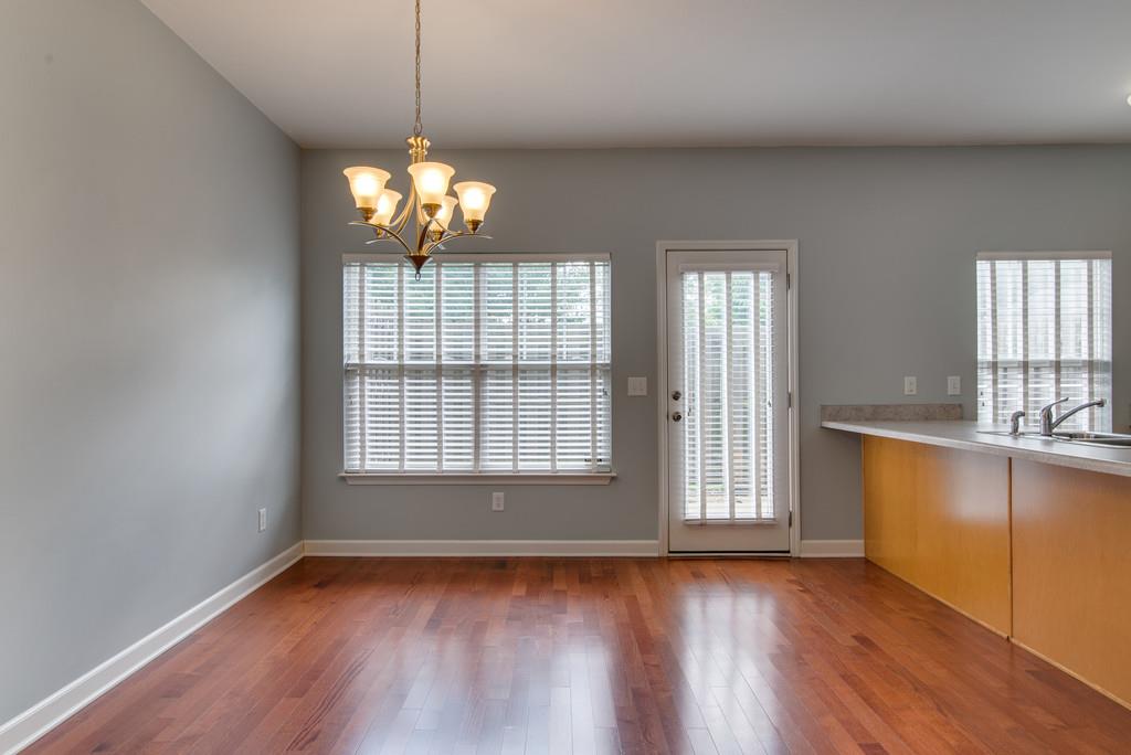 553 Rosedale Avenue, Unit 127 Nashville, TN 37211 - Photo 11 of 27 a view of an empty room with wooden floor and a window