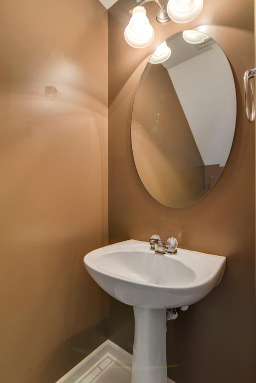 553 Rosedale Avenue, Unit 127 Nashville, TN 37211 - Photo 13 of 27 a bathroom with a sink and a mirror