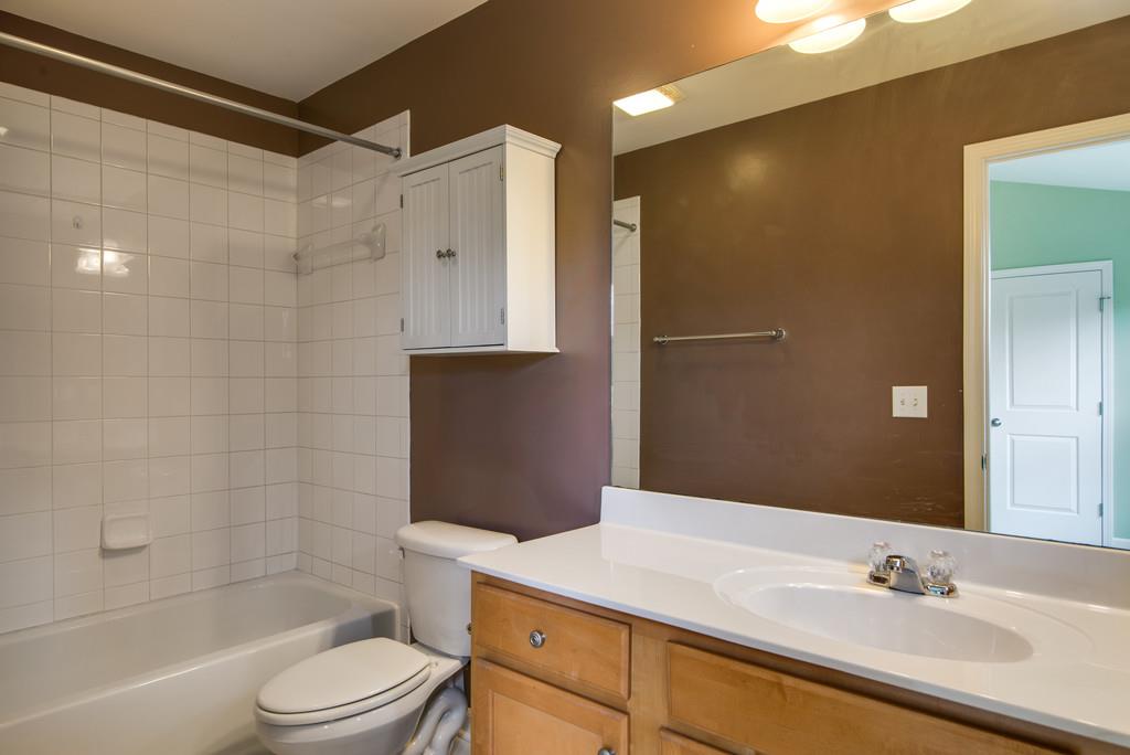 553 Rosedale Avenue, Unit 127 Nashville, TN 37211 - Photo 21 of 27 a bathroom with a sink a toilet and shower
