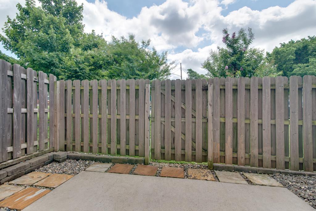 553 Rosedale Avenue, Unit 127 Nashville, TN 37211 - Photo 23 of 27 a view of a building with wooden fence