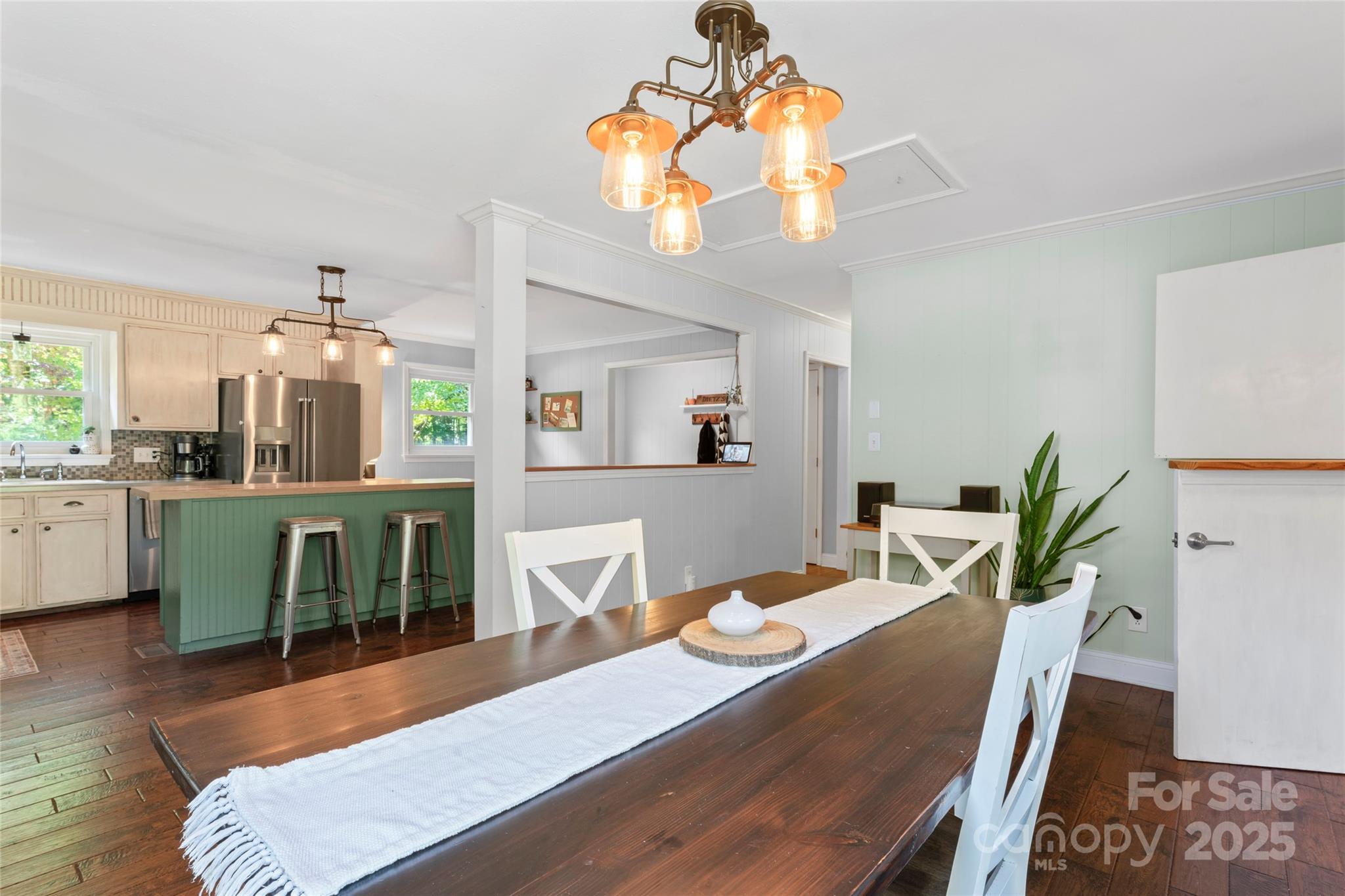 14217 Phillips Road Matthews, NC 28105 - Photo 11 of 38 a view of a dining room with furniture and wooden floor