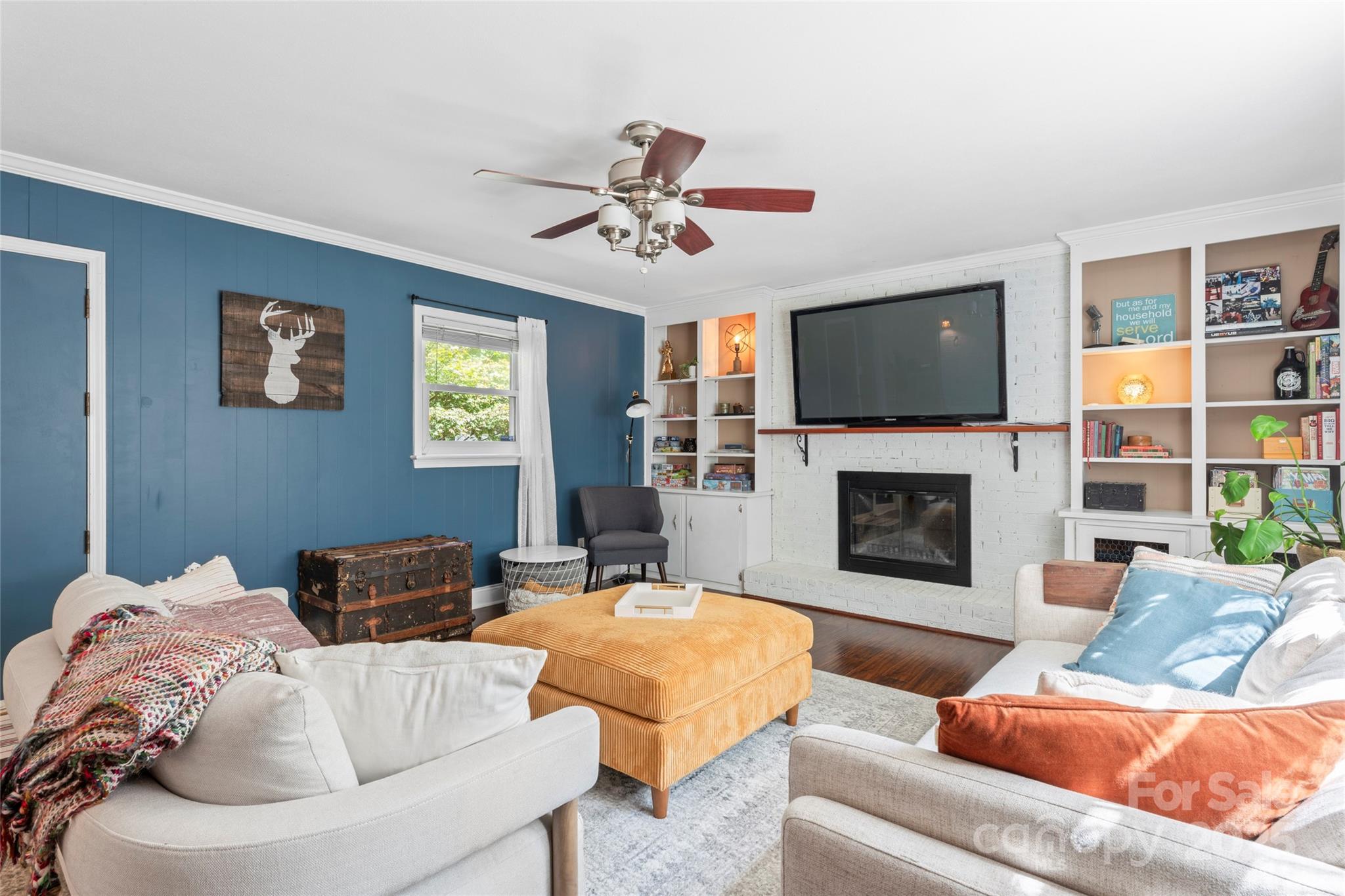 14217 Phillips Road Matthews, NC 28105 - Photo 16 of 38 a living room with furniture fireplace and a flat screen tv