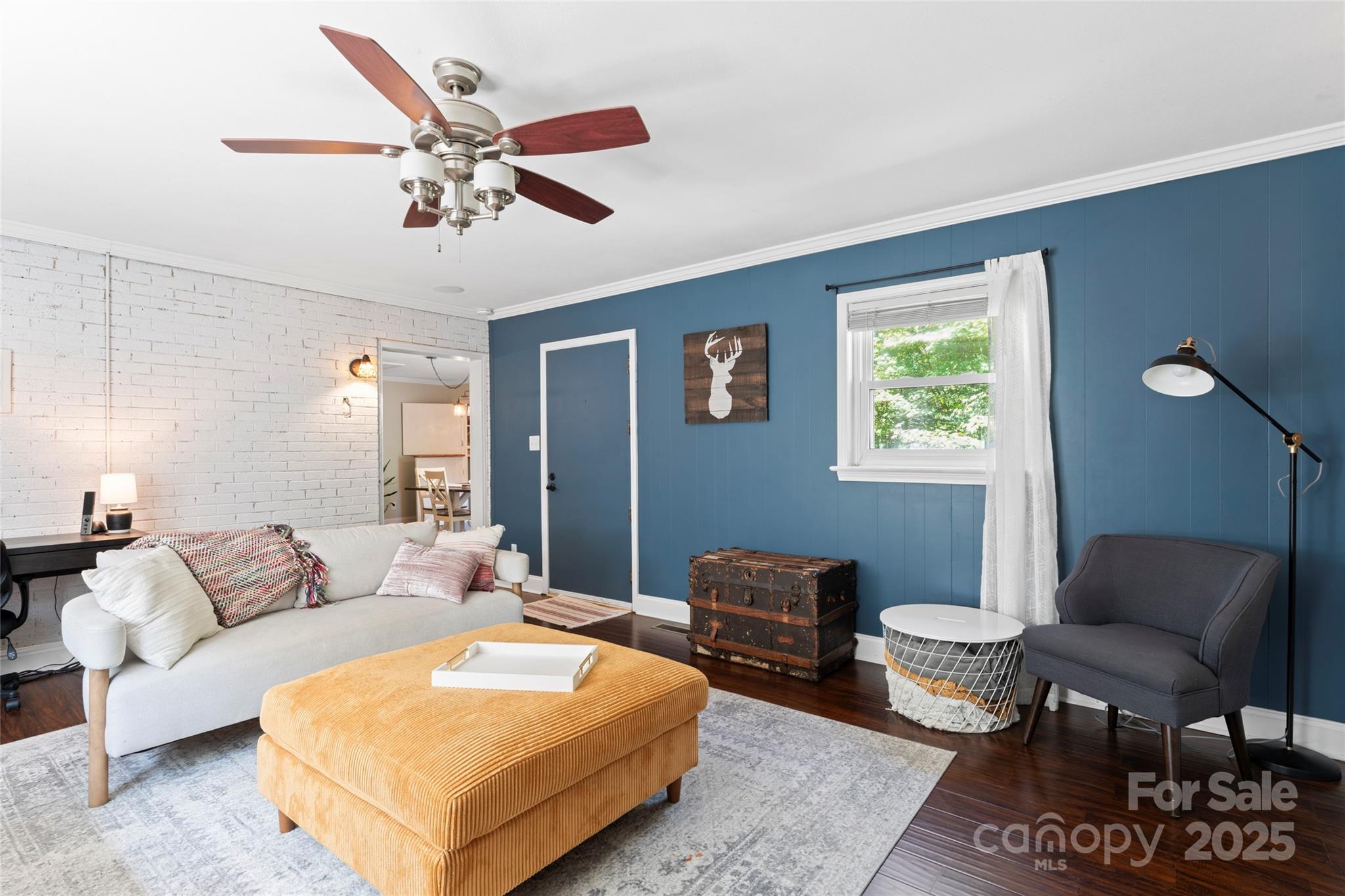 14217 Phillips Road Matthews, NC 28105 - Photo 17 of 38 a living room with furniture and a ceiling fan