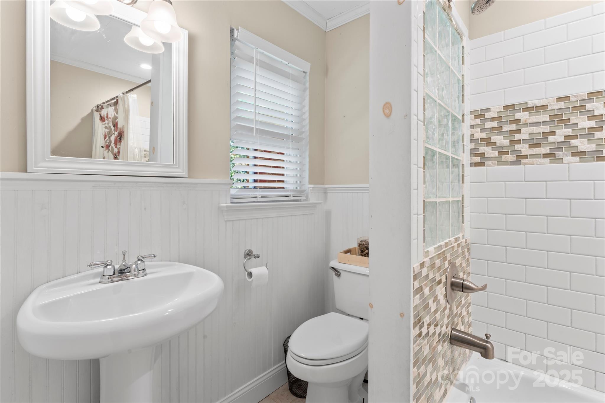 14217 Phillips Road Matthews, NC 28105 - Photo 24 of 38 a bathroom with a sink mirror and toilet