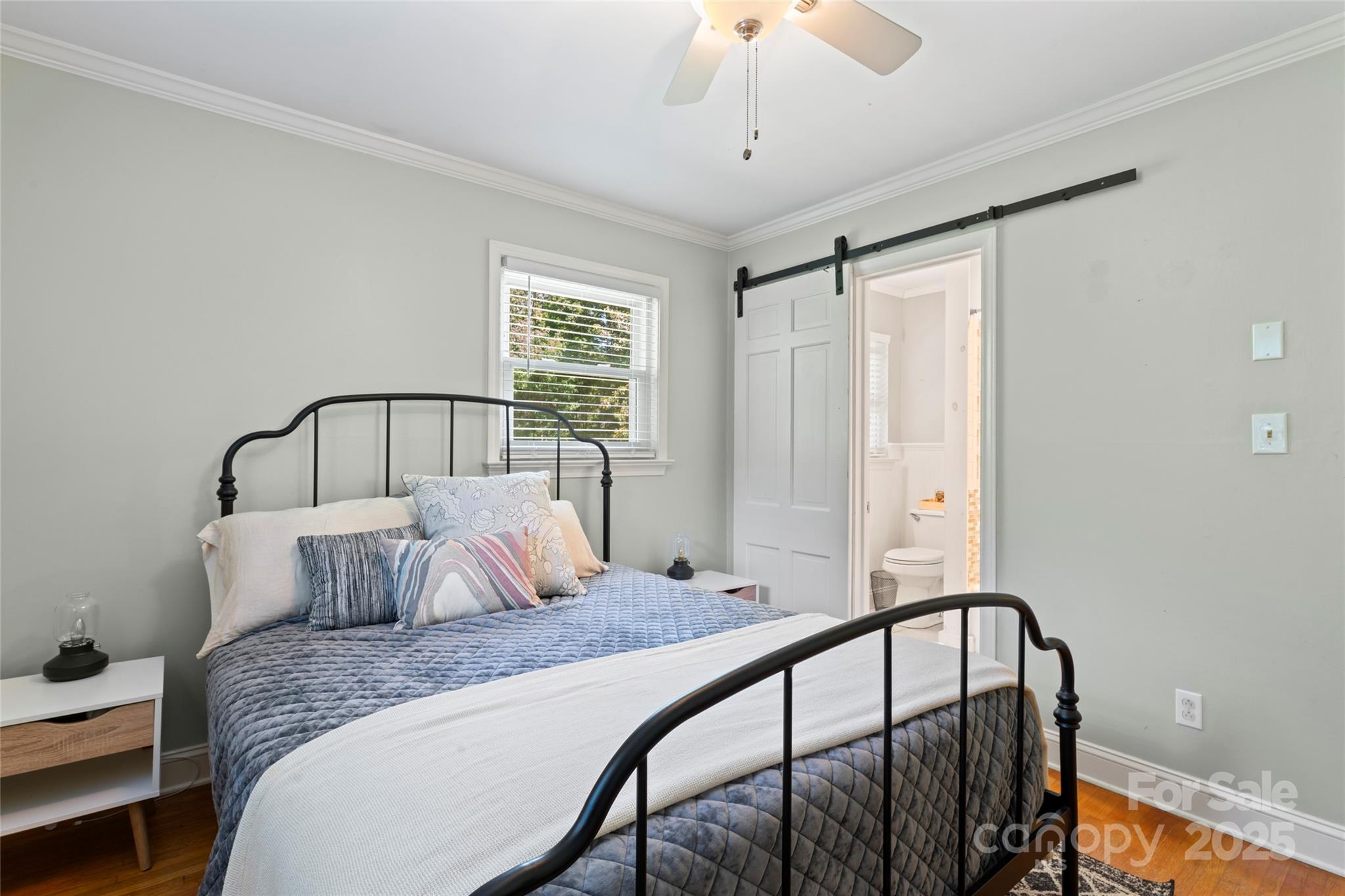 14217 Phillips Road Matthews, NC 28105 - Photo 28 of 38 a bedroom with bed and wooden floor
