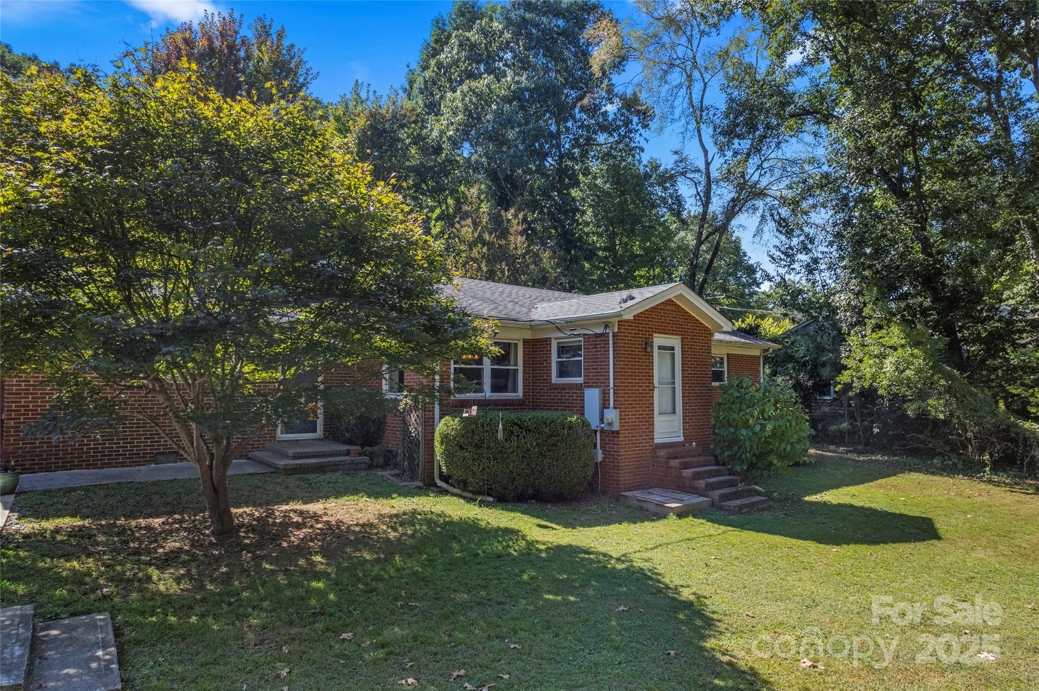 14217 Phillips Road Matthews, NC 28105 - Photo 32 of 38 a front view of a house with garden