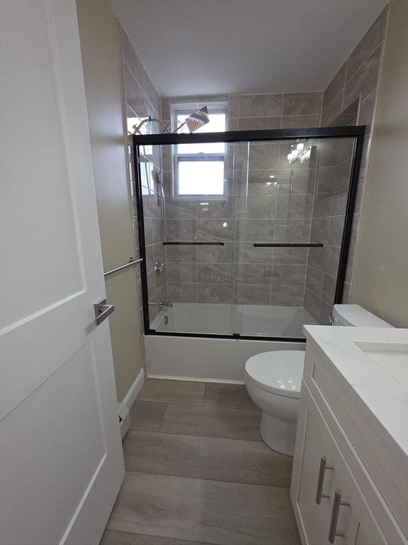 475 Purchase Street, Unit 3 New Bedford, MA 02740 - Photo 16 of 20 a bathroom with a shower and a toilet
