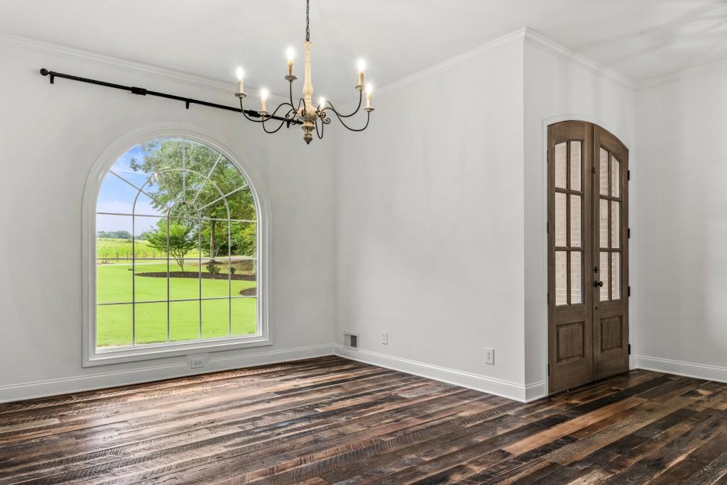 300 Potts Lane Covington, GA 30016 - Photo 20 of 76 a view of a room with window wooden floor and livingroom