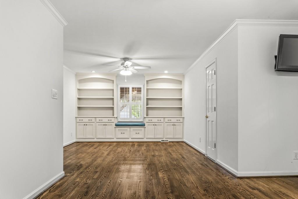 300 Potts Lane Covington, GA 30016 - Photo 24 of 76 a view of empty room with wooden floor and windows