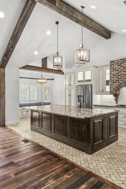 300 Potts Lane Covington, GA 30016 - Photo 46 of 76 a kitchen with stainless steel appliances granite countertop a stove a sink and a wooden floors