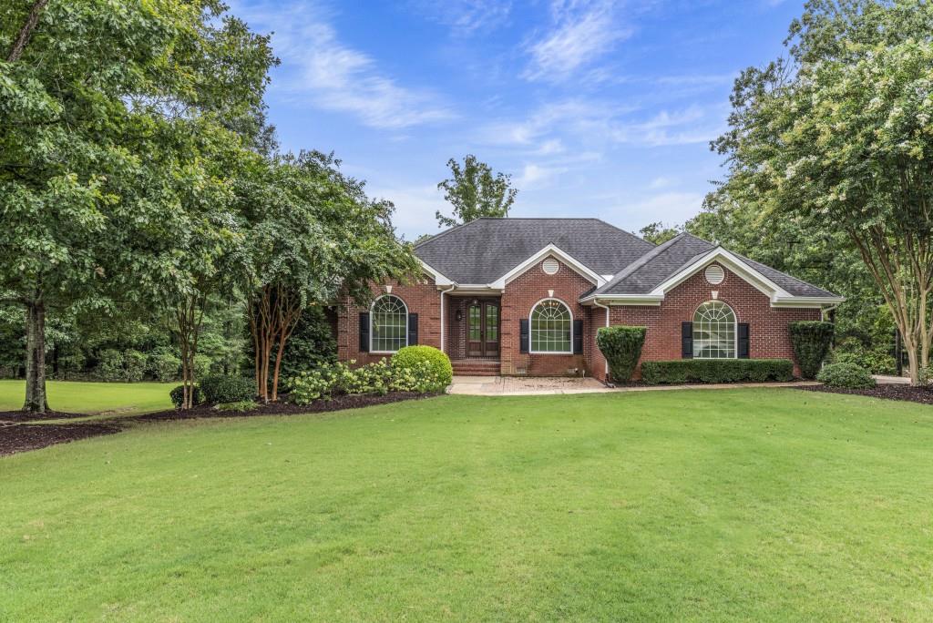 300 Potts Lane Covington, GA 30016 - Photo 54 of 76 a front view of a house with a yard