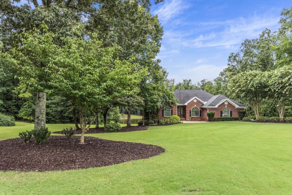 300 Potts Lane Covington, GA 30016 - Photo 56 of 76 a view of a house with a yard