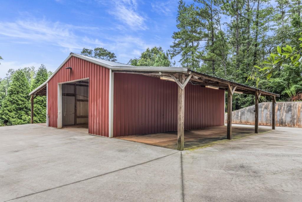 300 Potts Lane Covington, GA 30016 - Photo 58 of 76 a front view of a house with a garage