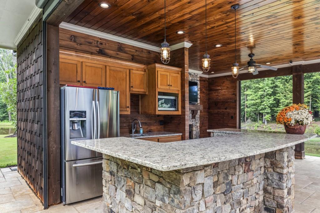 300 Potts Lane Covington, GA 30016 - Photo 63 of 76 a kitchen with stainless steel appliances granite countertop a stove and a refrigerator