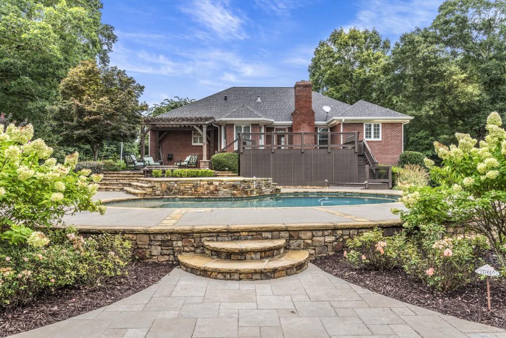300 Potts Lane Covington, GA 30016 - Photo 64 of 76 a front view of a house with garden