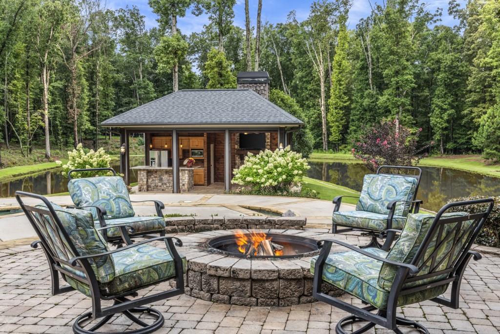 300 Potts Lane Covington, GA 30016 - Photo 73 of 76 a backyard of a house with yard barbeque oven and outdoor seating