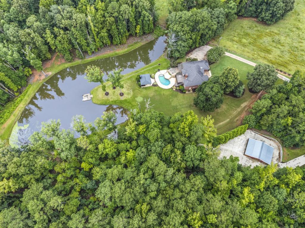 300 Potts Lane Covington, GA 30016 - Photo 8 of 76 an aerial view of a house with a yard lake lake and mountain view