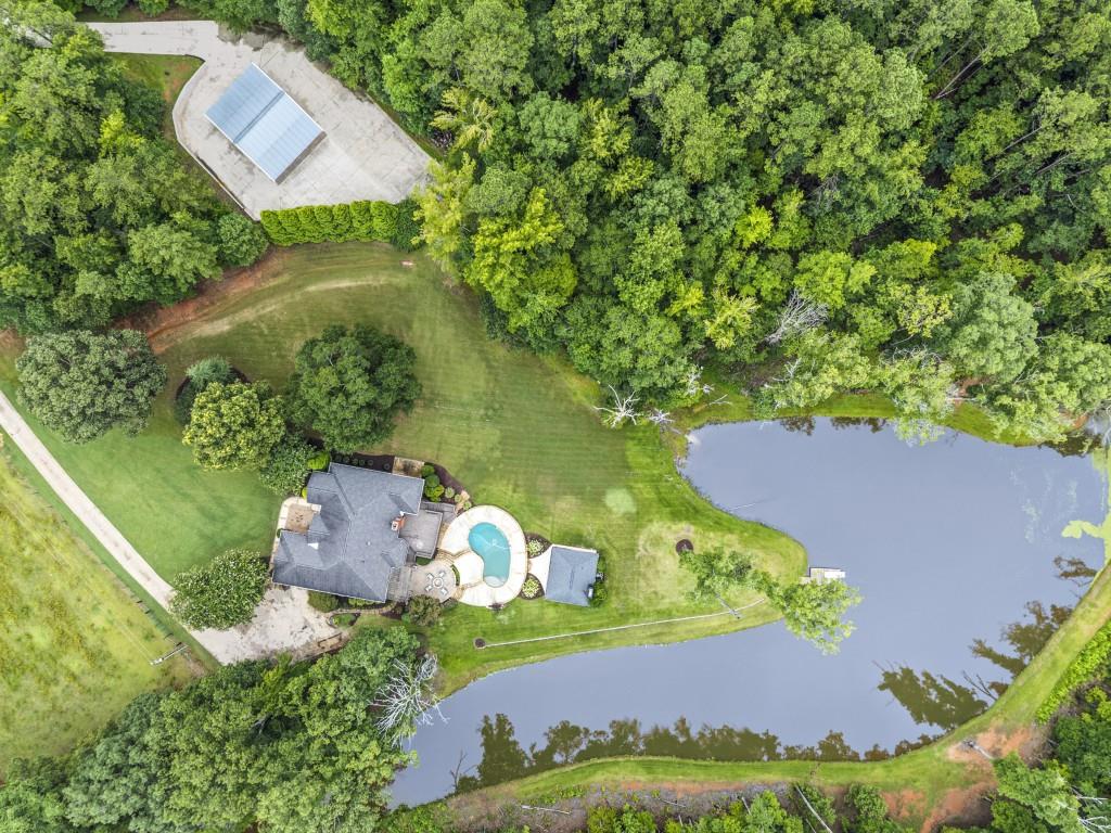 300 Potts Lane Covington, GA 30016 - Photo 9 of 76 an aerial view of a house with a garden and a yard