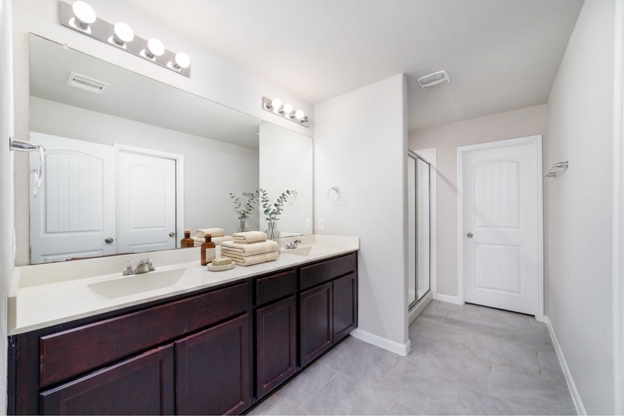 8307 Oakleaf Meadow Court Rosharon, TX 77583 - Photo 19 of 39 a bathroom with a double vanity sink mirror and double