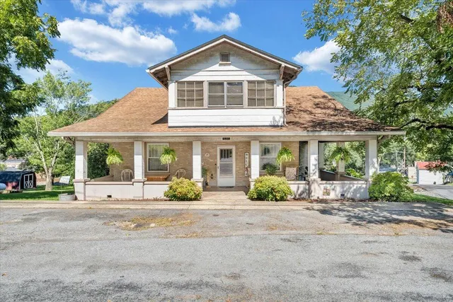 a view of a bedroom with a door and a window