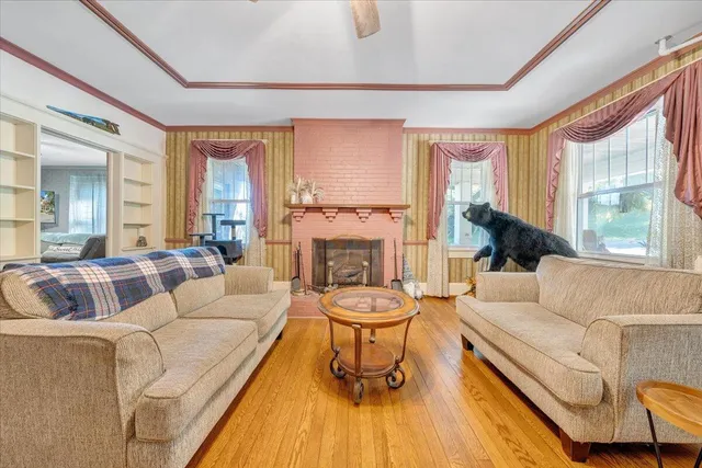 a living room with furniture and windows