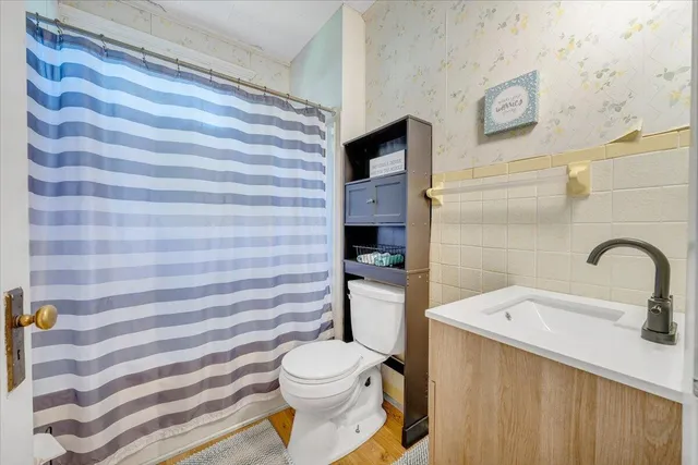 a view of a dining room with furniture wooden floor and chandelier