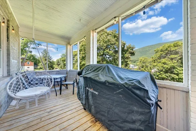 a front view of a house with yard and porch