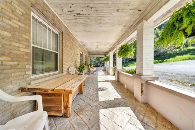 a view of yard with swimming pool and green space