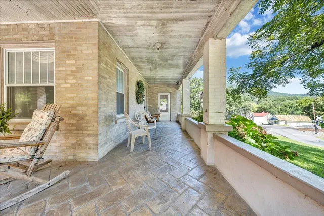 a view of a house with a garden and yard