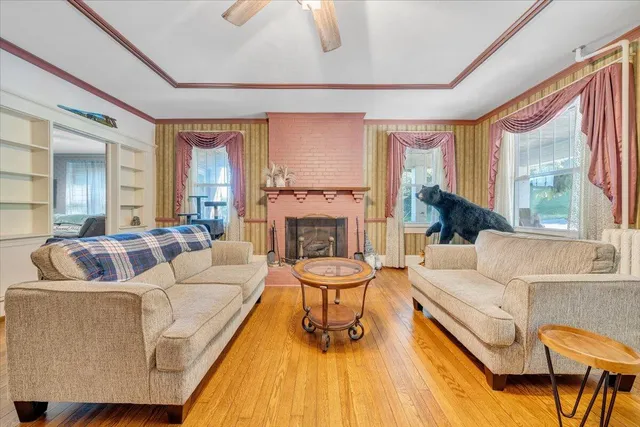 a living room with furniture and a fireplace