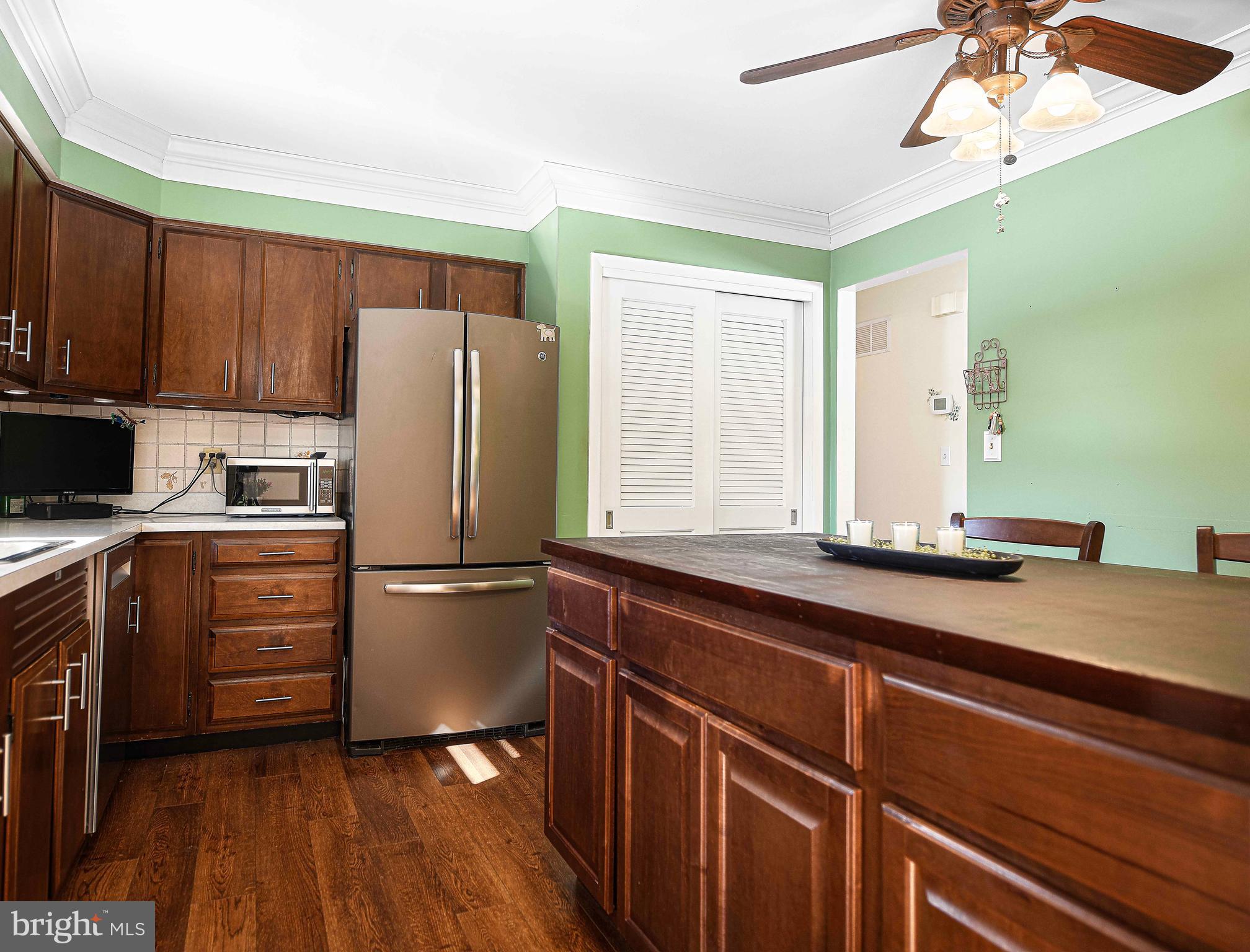 3204 Hunt Road Fallston, MD 21047 - Photo 15 of 54 a kitchen with a refrigerator a sink and cabinets