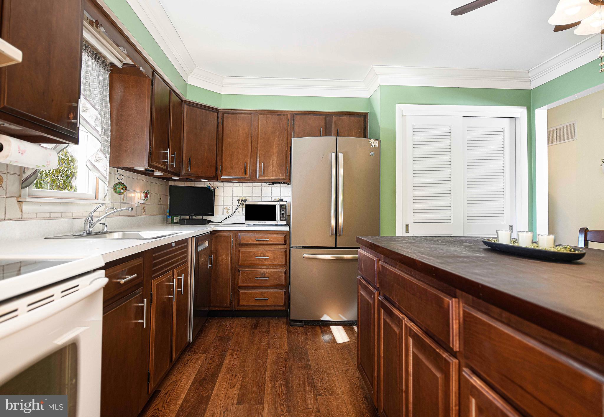 3204 Hunt Road Fallston, MD 21047 - Photo 16 of 54 a kitchen with stainless steel appliances granite countertop a refrigerator sink and cabinets