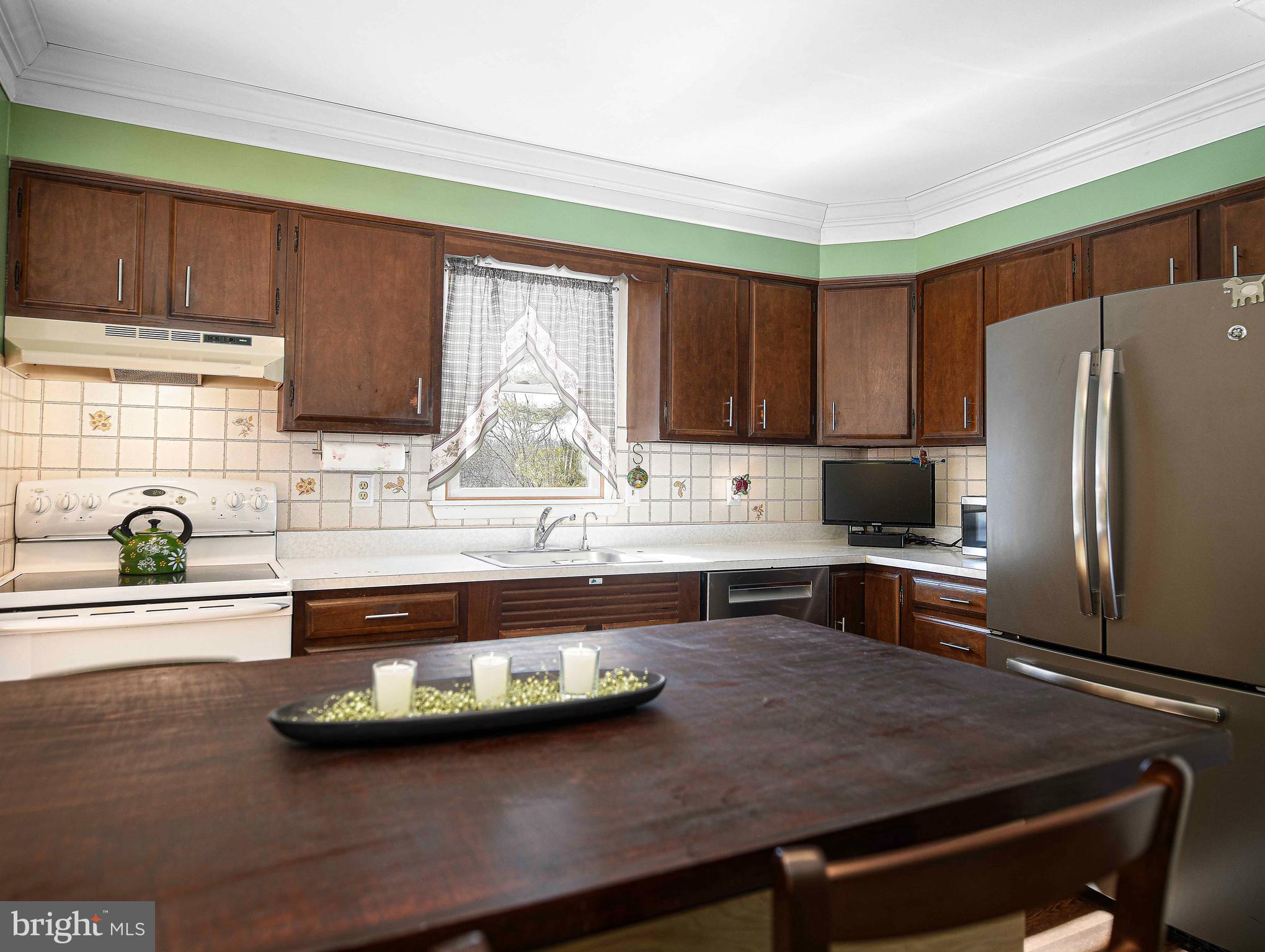 3204 Hunt Road Fallston, MD 21047 - Photo 17 of 54 a kitchen with kitchen island a sink stove and refrigerator