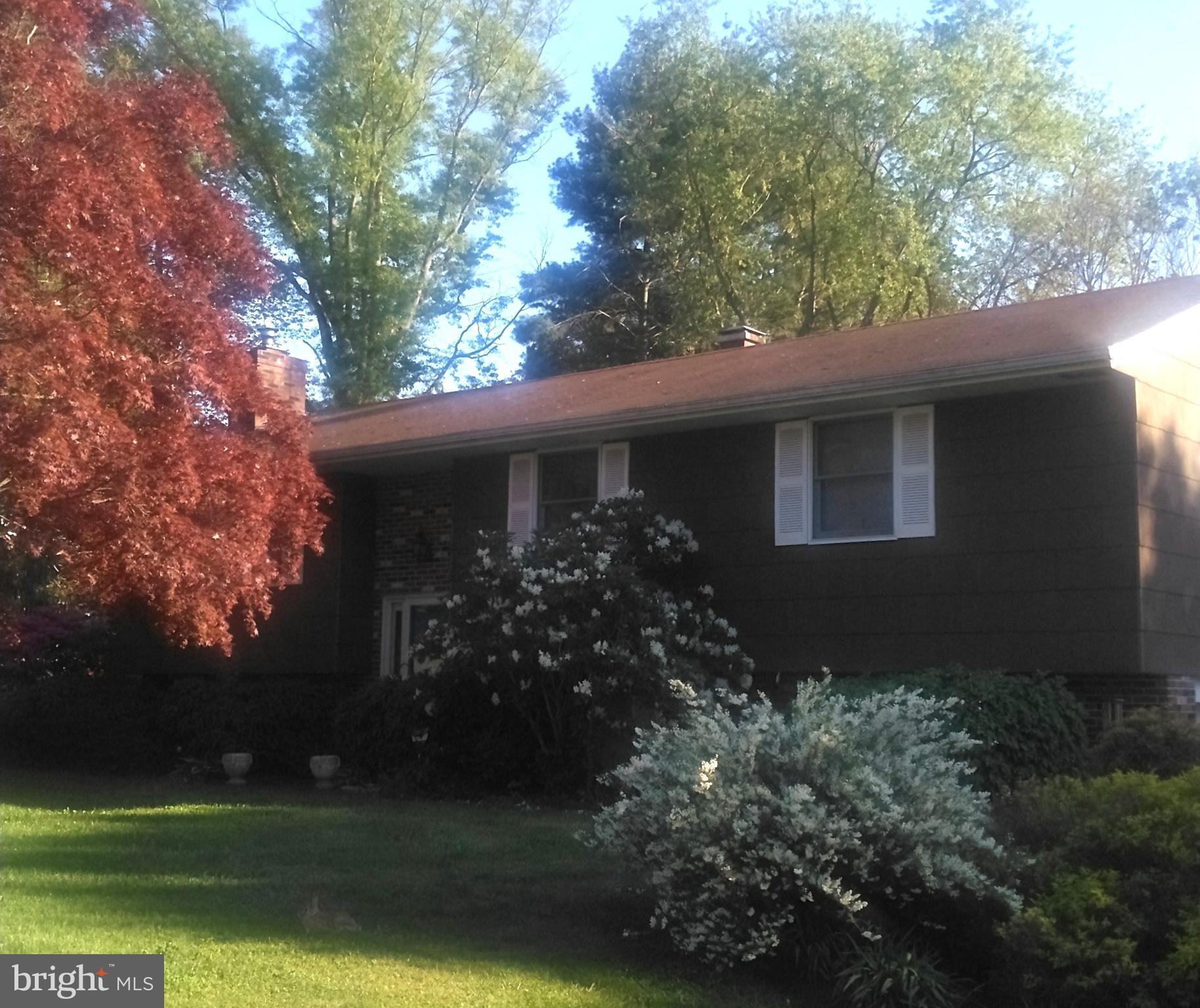 3204 Hunt Road Fallston, MD 21047 - Photo 2 of 5 a front view of a house with garden