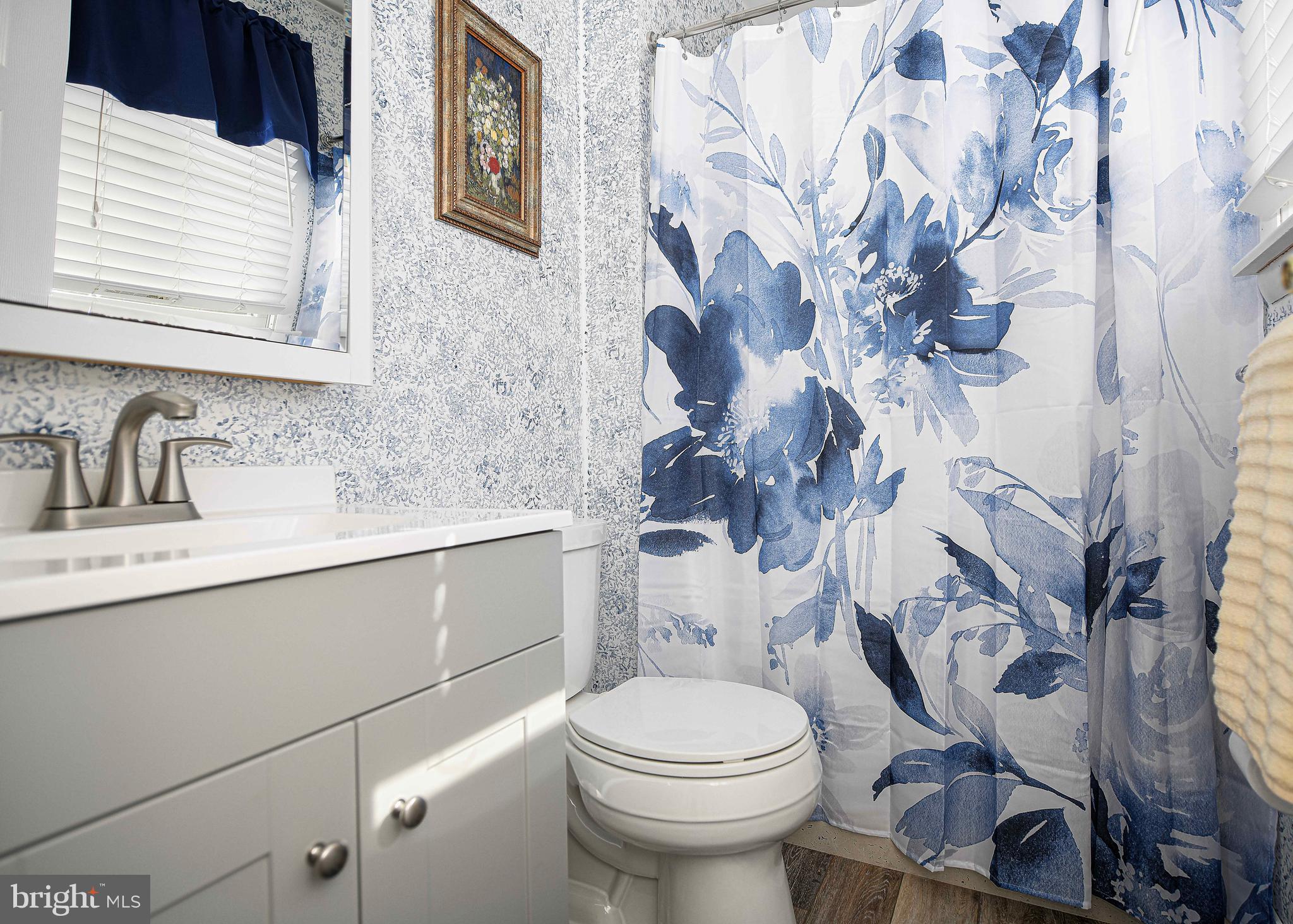 3204 Hunt Road Fallston, MD 21047 - Photo 21 of 54 a bathroom with a sink mirror vanity and toilet