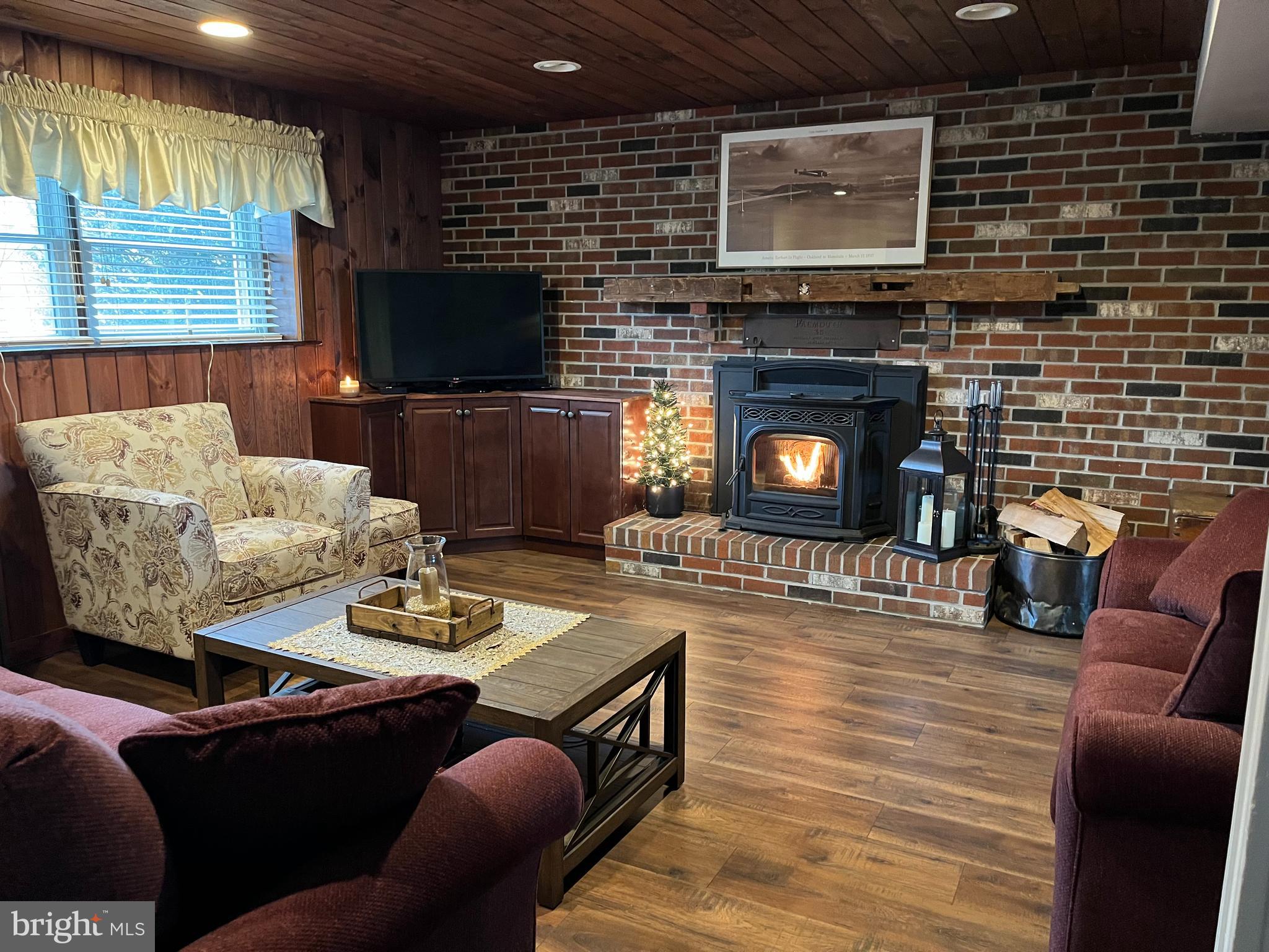 3204 Hunt Road Fallston, MD 21047 - Photo 25 of 54 a living room with furniture a flat screen tv and a fireplace
